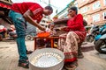 Group of family members preparing momo or dumplings on the side of the road. Street food