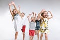 Group fashion cute preschooler kids friends posing together and looking at camera white background