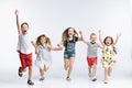 Group fashion cute preschooler kids friends posing together and looking at camera white background