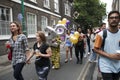 A group of fashionably dressed friends with numbers two and six are walking down the street, about to celebrate their birthday