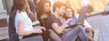 Group of fellow students with books and laptop Royalty Free Stock Photo