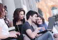 Group of fellow students with books and laptop Royalty Free Stock Photo