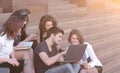 Group of fellow students with books and laptop Royalty Free Stock Photo