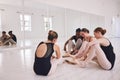 Group of female ballet dancers getting ready or dressing in a ballet hub, studio or class. Young, cheerful ballerina