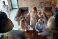 Group of female colleagues enjoy chatting at a short break at the workplace. Business, office, job Royalty Free Stock Photo