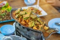 Group of female friends enjoy eating with acacia pennata omelette sour soup in fish shape hot pot in the restaurant. Royalty Free Stock Photo