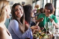 Group Of Female Friends Enjoying Meal In Restaurant Together