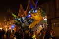 Group of female holding the dragon lantern at night of Mayfield Rye Bonfire during the parade, UK