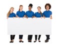 Group Of Female Janitors Holding Billboard Royalty Free Stock Photo