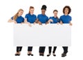 Group Of Female Janitors Holding Billboard Royalty Free Stock Photo