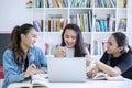 Group of female teenagers studying in the library Royalty Free Stock Photo