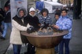 Group of female tourists warming hands during 2002 Winter Olympics, Salt Lake City, UT