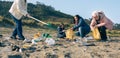 Female volunteers cleaning the beach