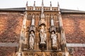 Group of figures above the entrance to the cathedral portal at Aachen Cathedral