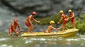Miniature Lifeguards Rescue Operation in a Yellow Boat Royalty Free Stock Photo