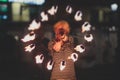 Group of fire artists fakir perform amazing show at night with flamethrowers, fire dancers, chain of fire, extreme breathing