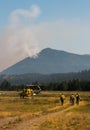 Group of firefighters at helicopter vertical Kootenal Forest fire