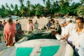 Group of fishermen near the boat on the beach in Arugambay, Sri Lanka
