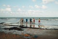 Fishermen pulling a net on a sandy beach. Royalty Free Stock Photo