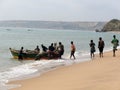 Group of fishermen returning from the sea with their fish ready to be cooked or sold on the local market.