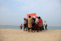 Fishermen work hard to bring the fishing boat to the shore