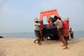 Fishermen work hard to bring the fishing boat to the shore