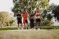 Group of fit people standing in the park and posing Royalty Free Stock Photo