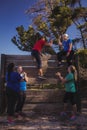 Group of fit women giving high five to each other during obstacle course training Royalty Free Stock Photo