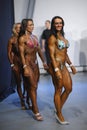 Group of fitness girls in bikinis standing backstage waiting for their turn to perform. World Cup 2013. Kyiv, Ukraine