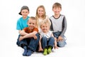 The group of five children siting on the floor