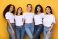 Group Of Five Diverse Models Ladies Posing On Yellow Background
