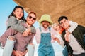 Group of five multiethnic friends smiling and having fun looking at camera. Royalty Free Stock Photo