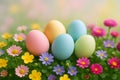 A group of five pastel colored Easter eggs resting in a bed of green leaves and colorful spring flowers with a soft bokeh Royalty Free Stock Photo