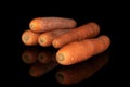 Fresh orange carrot isolated on black glass Royalty Free Stock Photo