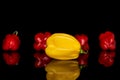 Hot chili habanero isolated on black glass