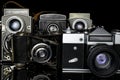 Vintage antique camera isolated on black glass Royalty Free Stock Photo