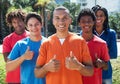 Group of five young men showing thumbs up Royalty Free Stock Photo