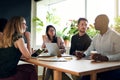 Diverse business colleagues having a meeting around a boardroom Royalty Free Stock Photo