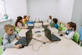 group of focused kids working with computers