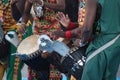 Group of folk drummers from Kenya perform in colorful attire in a spacious setting Royalty Free Stock Photo