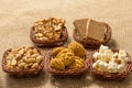 Group of food of Festa Junina in wicker baskets, typical brazilian party: Peanut, Cookie, Popcorn, Pe de Moleque, Pacoca, Corn. J