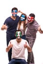 Group of football fans looking happy with their faces painted support national teams of Croatia, Nigeria, Argentina, Iceland isola Royalty Free Stock Photo