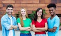 Group of four african and latin american and caucasian young adults Royalty Free Stock Photo