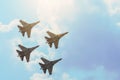 Group of four aircraft fighter jet airplane sun glow toned gradient clouds sky