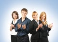 A group of four business persons clapping hands Royalty Free Stock Photo