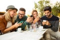 Group of four friends having fun a coffee together. Royalty Free Stock Photo