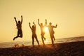 Group four friends fun beach sunset holiday Royalty Free Stock Photo