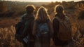 A group of four friends huddled together all facing away from the camera hands clasped as they prepare to take a leap Royalty Free Stock Photo