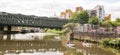 Group of four kayaks paddling on a canal in East London