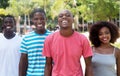 Group of four laughing african american woman and man